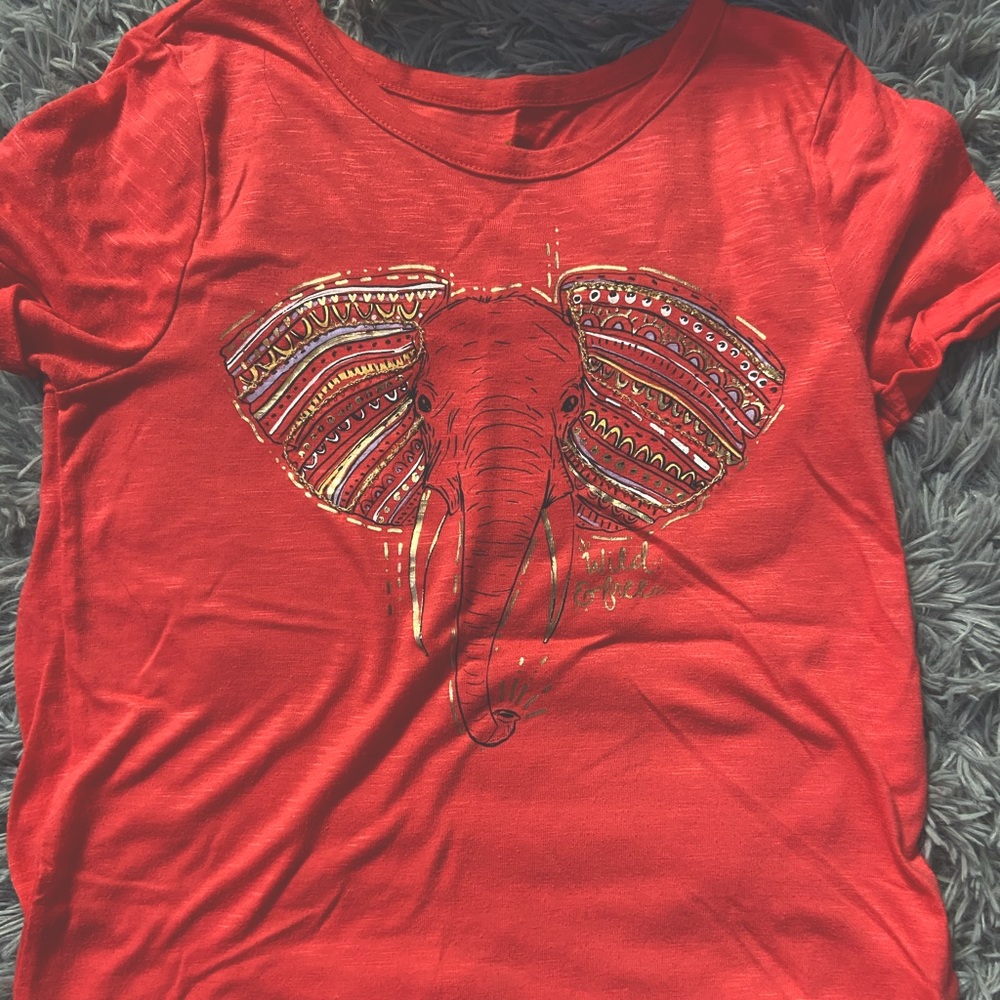 Red shirt with elephant on the front
